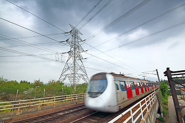 Image showing speed train under the power tower