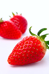 Image showing Three stawberries on the white background 