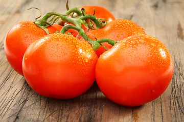 Image showing Five ripe tomatoes.