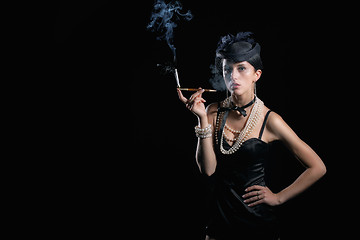Image showing Woman with cigarette vintage hat