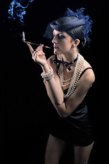 Image showing Woman with cigarette and long legs