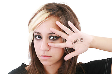 Image showing Close up shot of a angry teenager, isolated on white background 