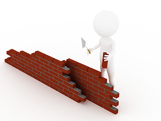 Image showing 3d man in a hardhat building brick wall 