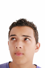 Image showing Young man looking up into open space. Isolated over white backgr