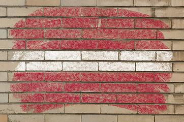 Image showing flag of latvia on grunge brick wall painted with chalk  