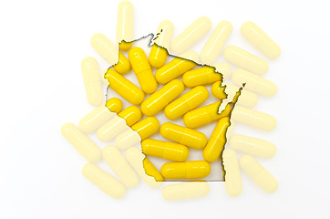 Image showing Outline map of wisconsin with transparent pills in the backgroun