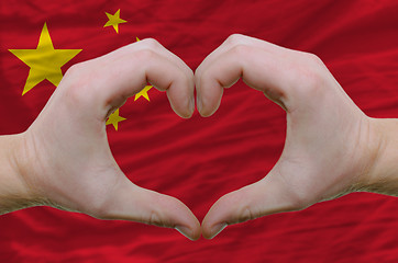 Image showing Heart and love gesture showed by hands over flag of china backgr