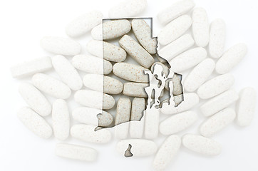 Image showing Outline map of rhode island with transparent pills in the backgr