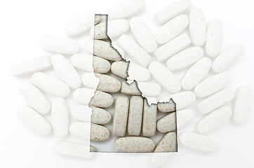 Image showing Outline map of Idaho with transparent pills in the background