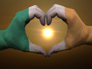 Image showing Heart and love gesture by hands colored in ireland flag during b