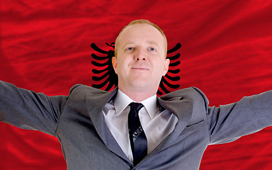 Image showing happy businessman because of profitable investment in albania