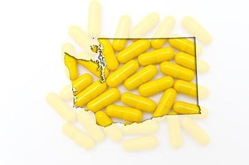 Image showing Outline map of washington with transparent pills in the backgrou