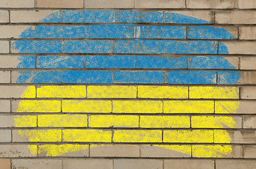 Image showing flag of ukraine on grunge brick wall painted with chalk  