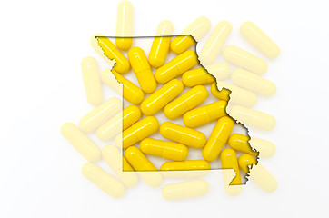 Image showing Outline map of missouri with transparent pills in the background