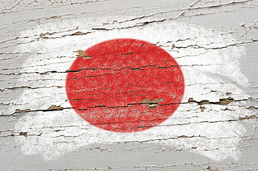 Image showing flag of Japan on grunge wooden texture painted with chalk  