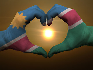 Image showing Heart and love gesture by hands colored in namibia flag during b