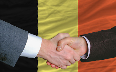 Image showing businessmen handshakeafter good deal in front of belgium flag