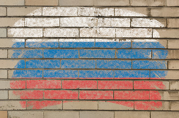 Image showing flag of Russia on grunge brick wall painted with chalk  