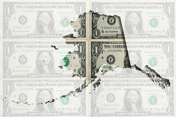 Image showing Outline map of Alaska with transparent american dollar banknotes