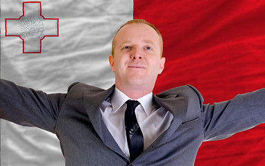 Image showing happy businessman because of profitable investment in malta stan