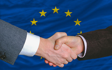 Image showing businessmen handshake after good deal in front of europe flag