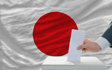 Image showing man voting on elections in japan