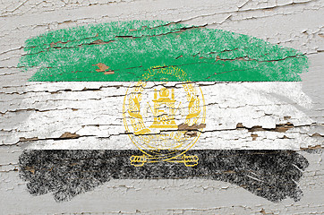 Image showing flag of afghanistan on grunge wooden texture painted with chalk 