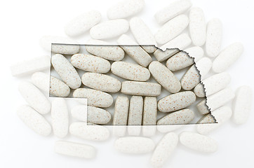 Image showing Outline map of nebraska with transparent pills in the background