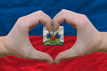 Image showing Heart and love gesture showed by hands over flag of haiti backgr