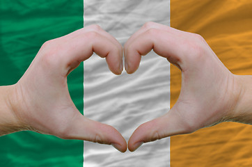 Image showing Heart and love gesture showed by hands over flag of ireland back