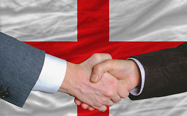 Image showing businessmen handshake after good deal in front of england flag