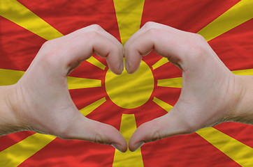 Image showing Heart and love gesture showed by hands over flag of macedonia ba