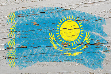 Image showing flag of khazakstan on grunge wooden texture painted with chalk  