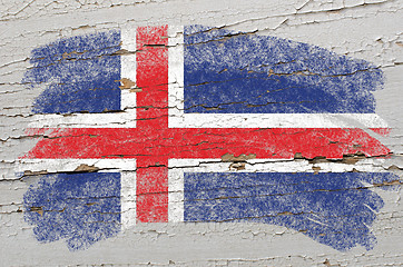 Image showing flag of iceland on grunge wooden texture painted with chalk  
