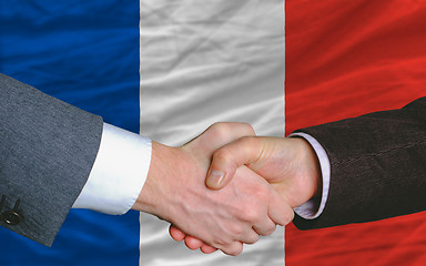 Image showing businessmen handshake after good deal in front of france flag