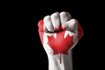 Image showing Fist painted in colors of canada flag