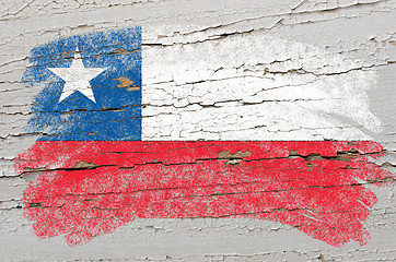 Image showing flag of chile on grunge wooden texture painted with chalk  