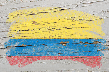 Image showing flag of columbia on grunge wooden texture painted with chalk  