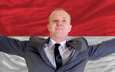 Image showing happy businessman because of profitable investment in indonesia 