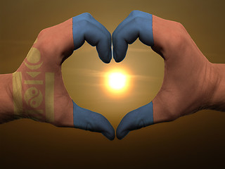 Image showing Heart and love gesture by hands colored in mongolia flag during 