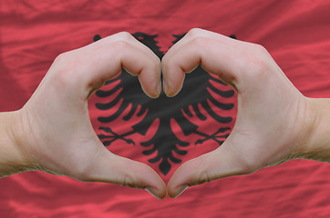 Image showing Heart and love gesture showed by hands over flag of Albania back