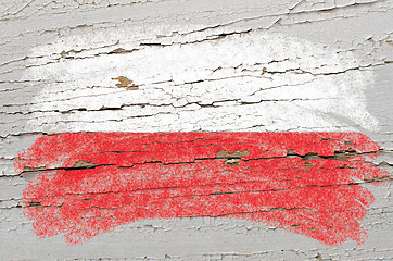 Image showing flag of poland on grunge wooden texture painted with chalk  