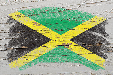 Image showing flag of jamaica on grunge wooden texture painted with chalk  