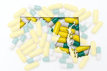 Image showing Outline map of maryland with transparent pills in the background