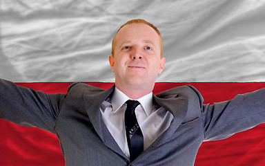 Image showing happy businessman because of profitable investment in poland sta