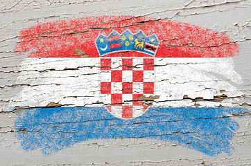 Image showing flag of Croatia on grunge wooden texture painted with chalk  