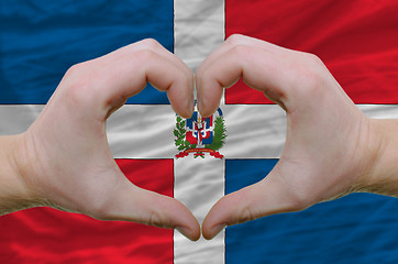 Image showing Heart and love gesture showed by hands over flag of dominican re