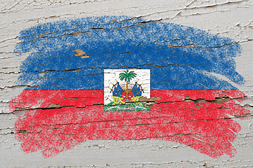 Image showing flag of haiti on grunge wooden texture painted with chalk  