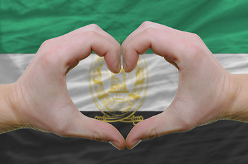 Image showing Heart and love gesture showed by hands over flag of Afghanistan 