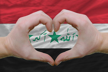 Image showing Heart and love gesture showed by hands over flag of iraq backgro